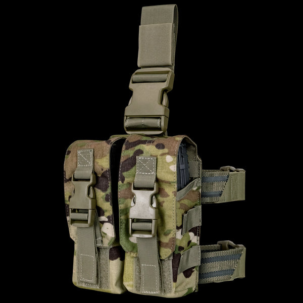 The Condor Drop Leg M4 Mag Pouch in Scorpion OCP features a camouflage pattern, two front pouches, adjustable straps, and quick-release buckles.
